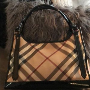 Authentic Burberry Patent Leather trimmed bag.